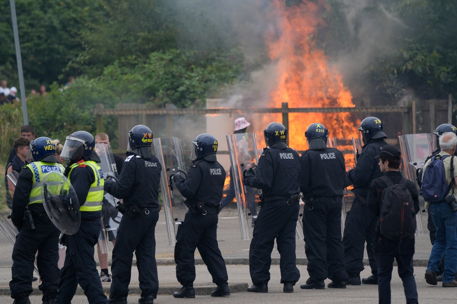 Demonstrators attack police and target hotel as riots continue 