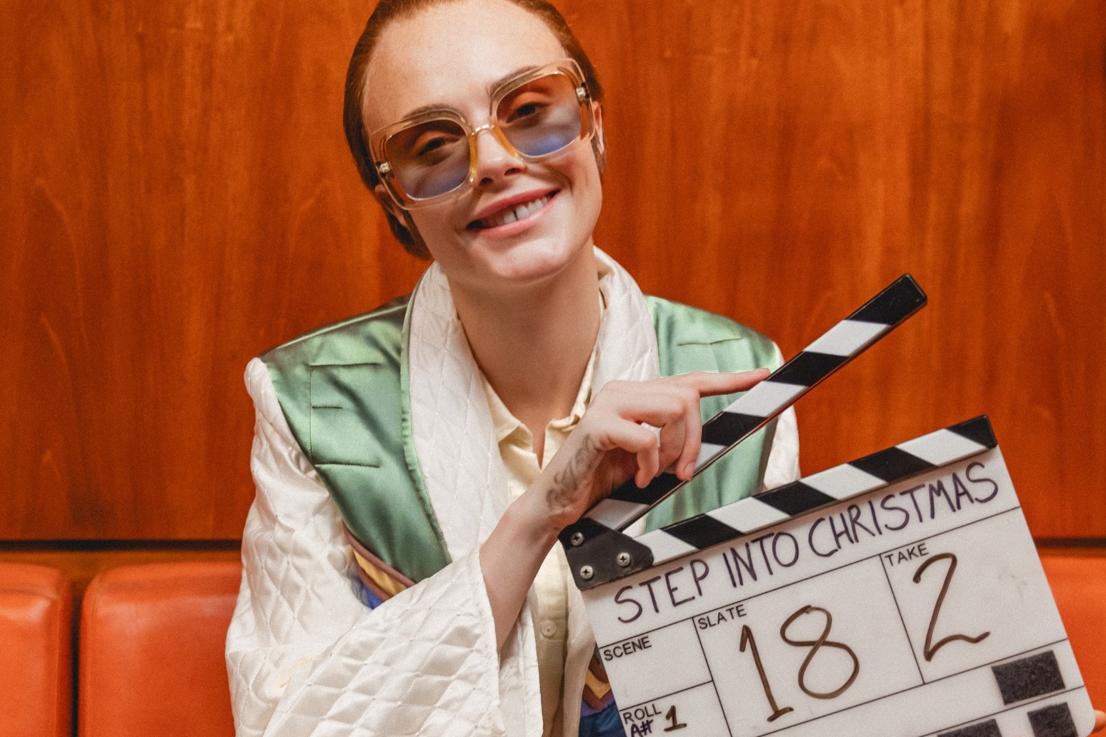 Cara Delevingne plays Elton John in Step Into Christmas video 